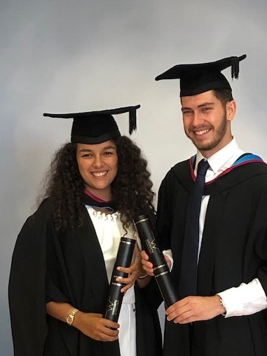 Hannah and Liam in their graduation gowns