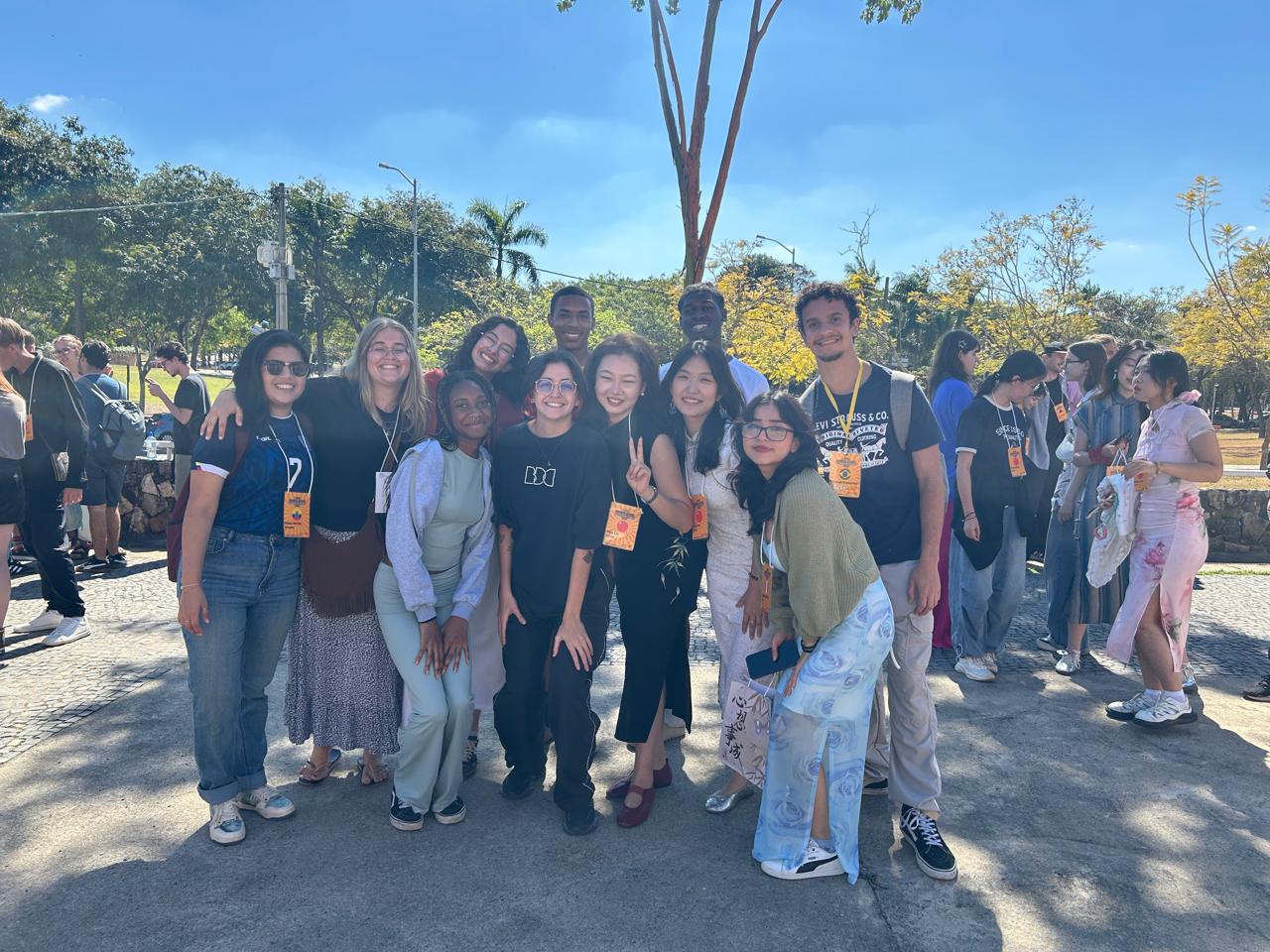 Students attending UFMG Summer school smile in group photo in sunny outdoors