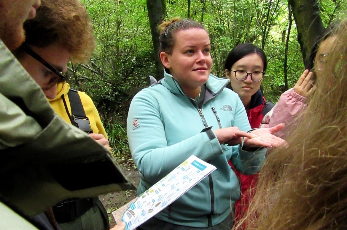 Dr Jess Savage teaching a group of GD109 students in Tocil Woods