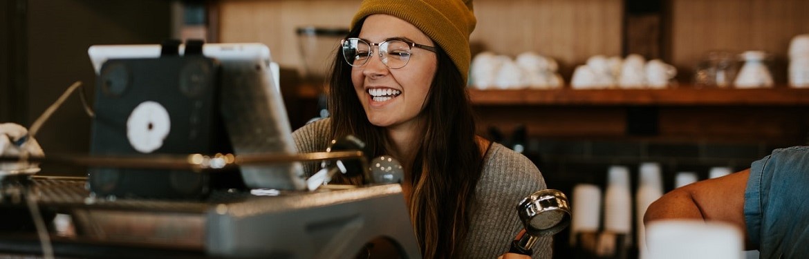 Barista working in a cafe on the coffee machines