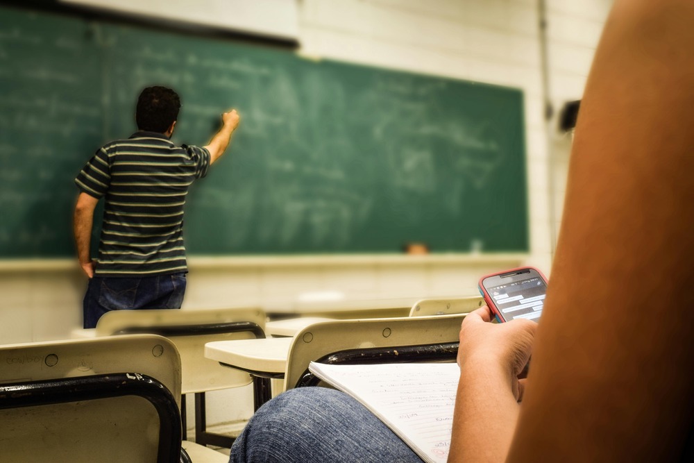 Teacher writing on a board