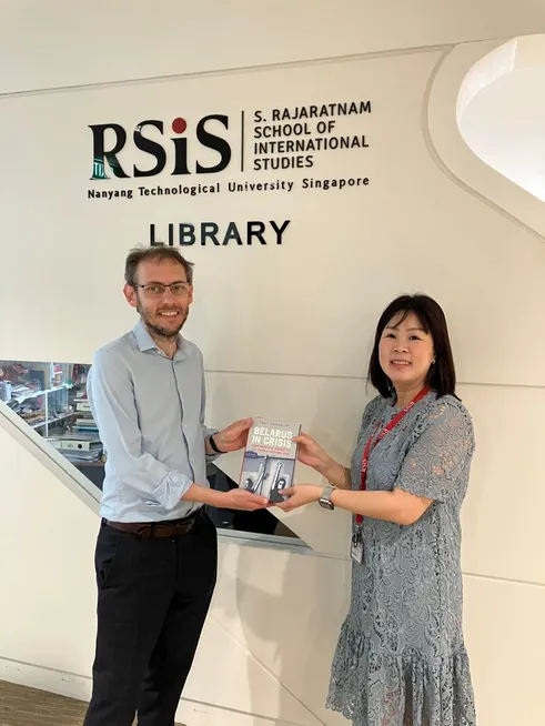 Presenting book to library