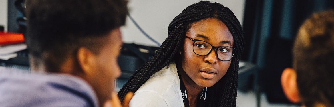 A close up of a Liberal Arts student in a workshop