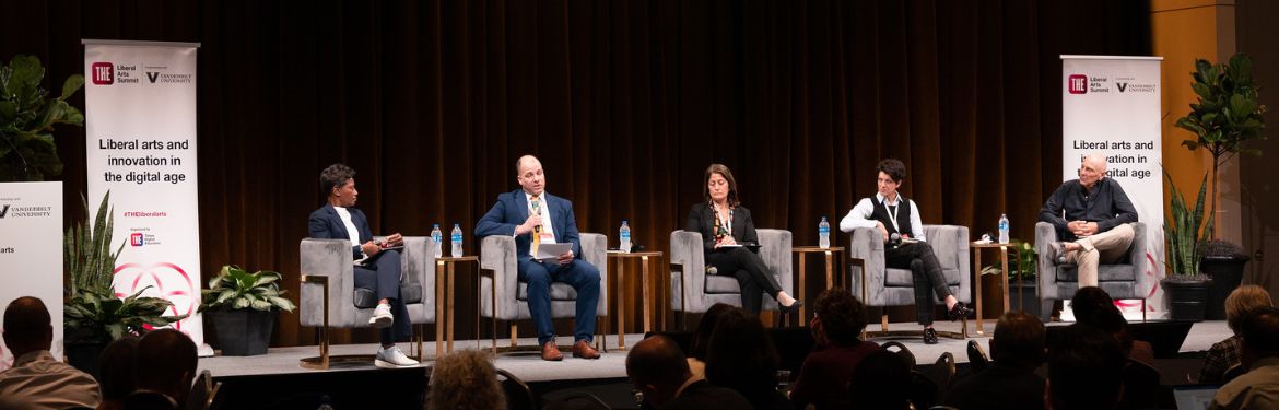 Panellists sit on stag at Liberal Arts Summit