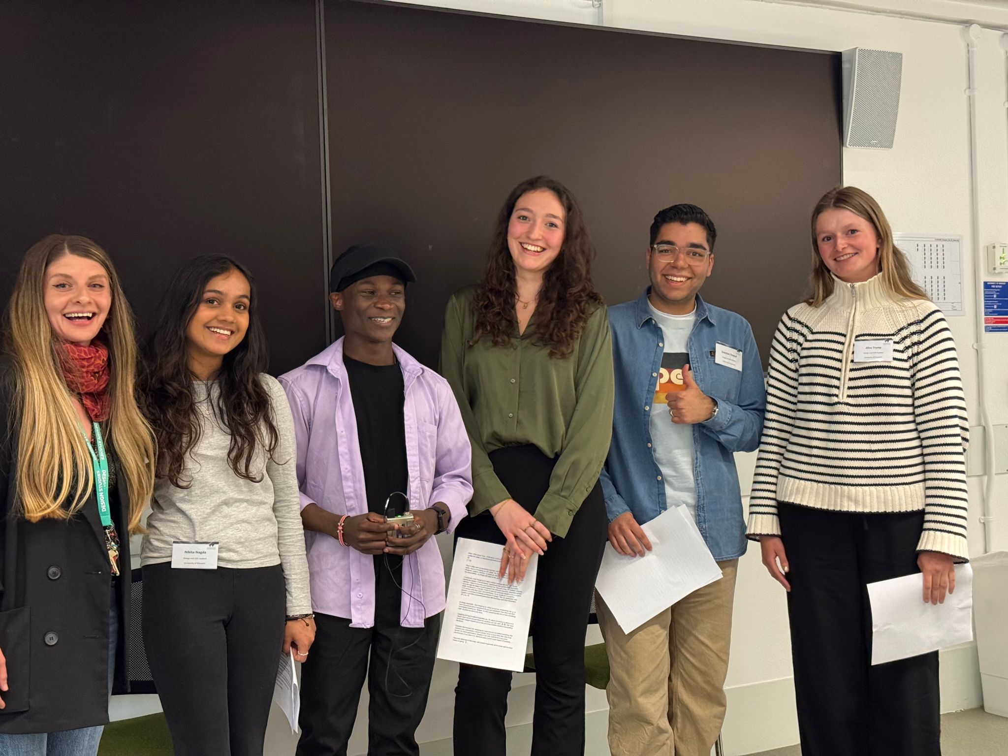 Design Studies students Zeeshan Yousuf, Alice Trump, Megan Carolan, and Nikita Nagda, with our Head of Design Studies Adela Glyn-Davies, smile at the camera