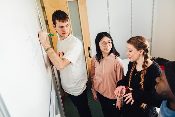 students working on whiteboard