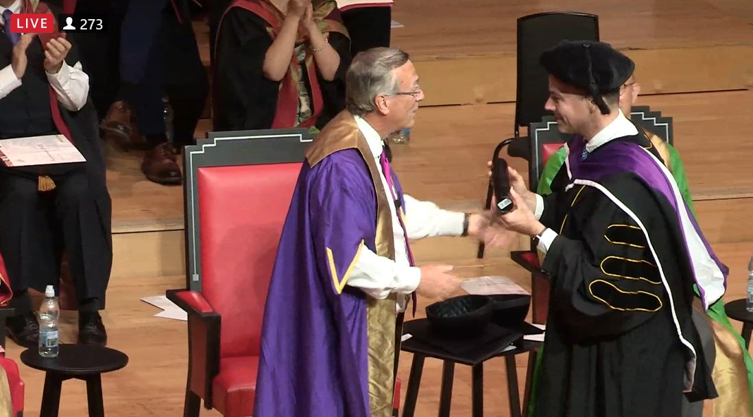 Bryan receiving his award from Vice-Chancellor, Stuart Croft at the 2022 Graduation Ceremony