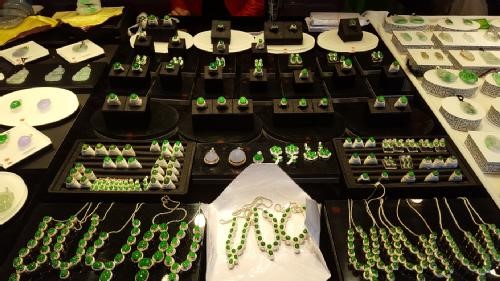 A range of green jade jewellery on sale in Tengchong Market, Yunna.