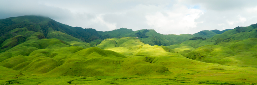 Miners on a precarious ledge, with a digger below them