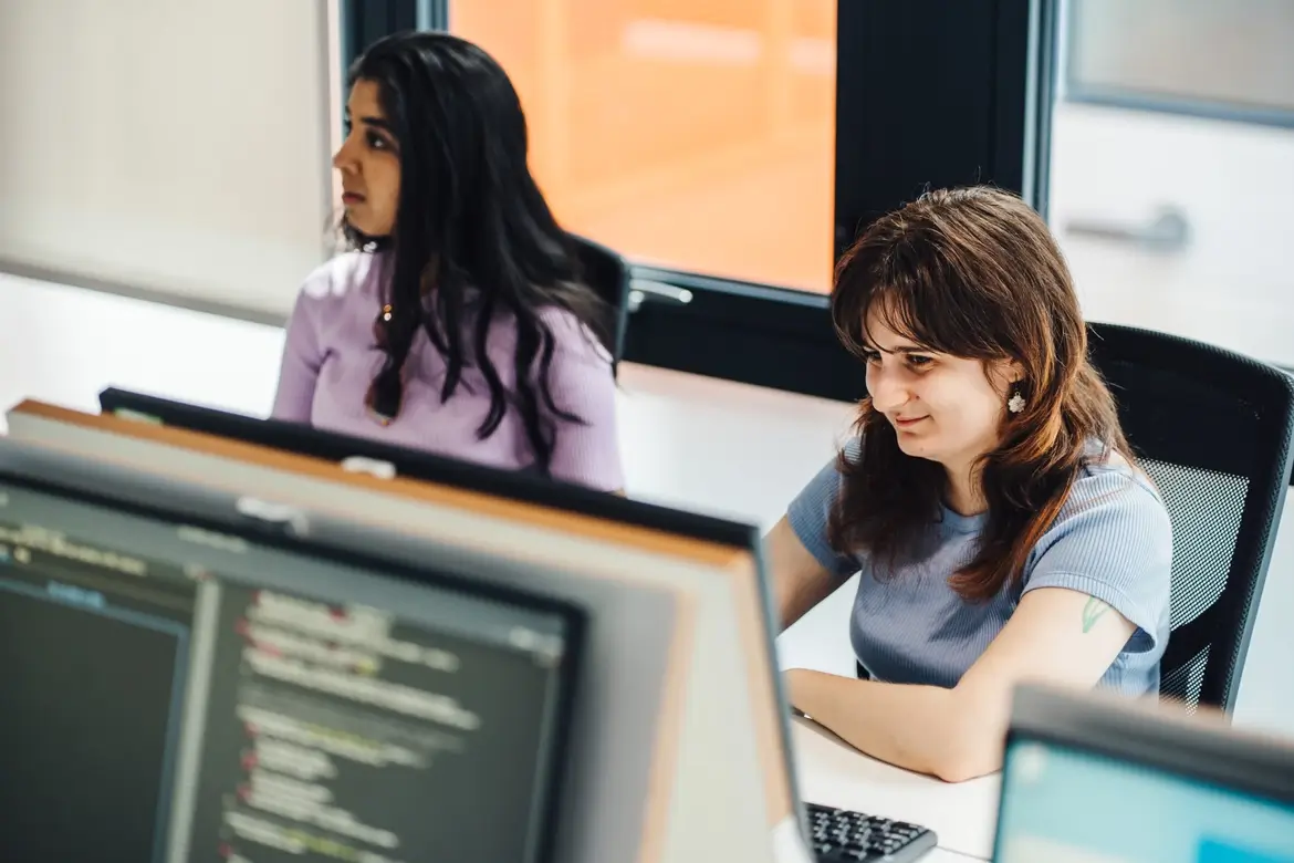 Two students working on computers