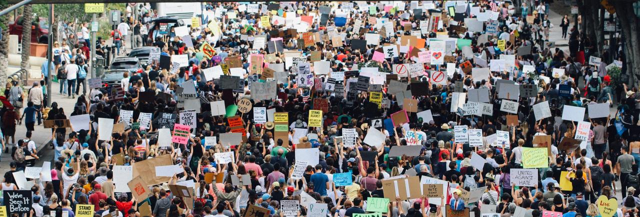 A demonstration with thousands of participants holding banners
