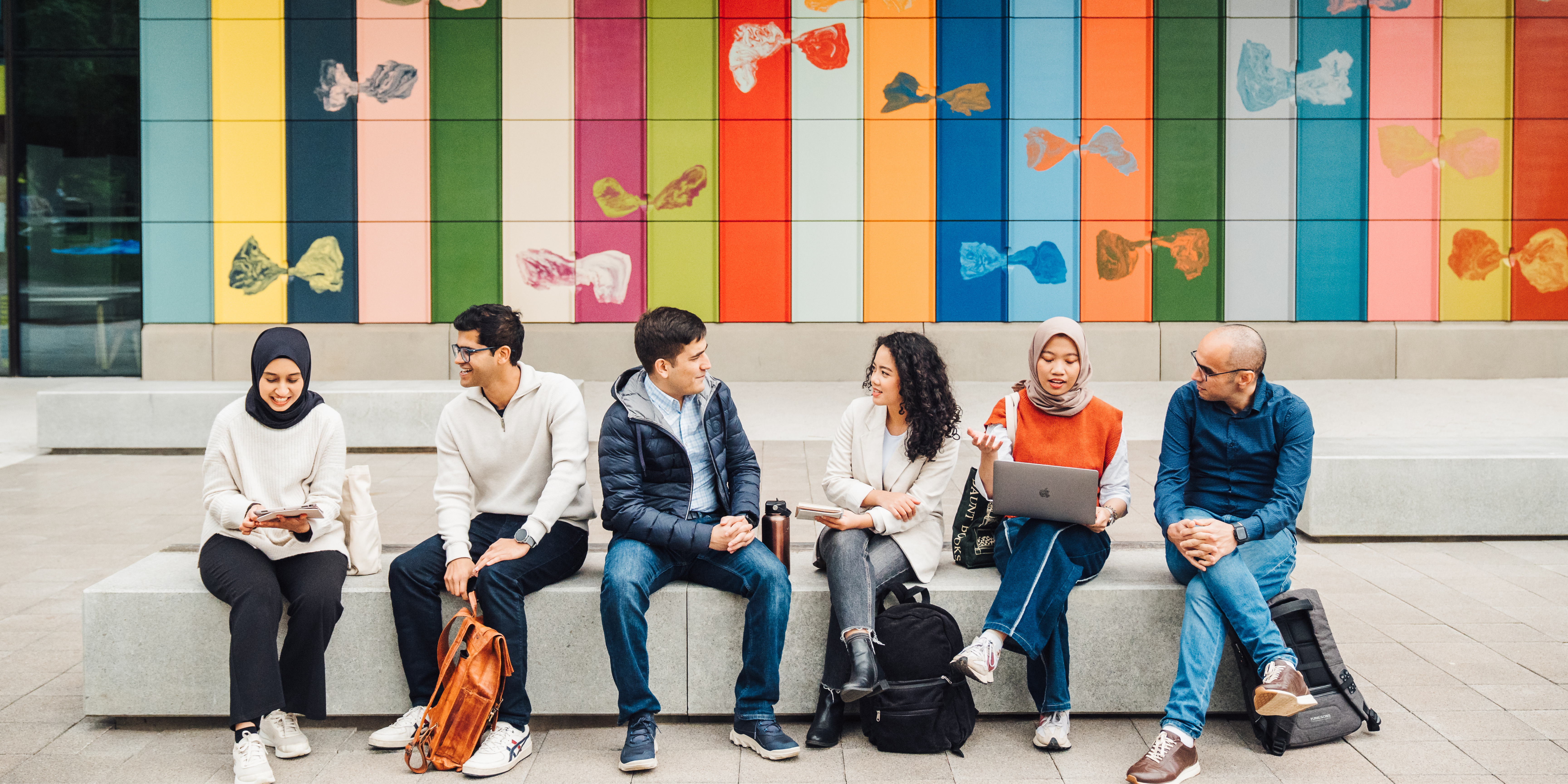 People sitting on a wall