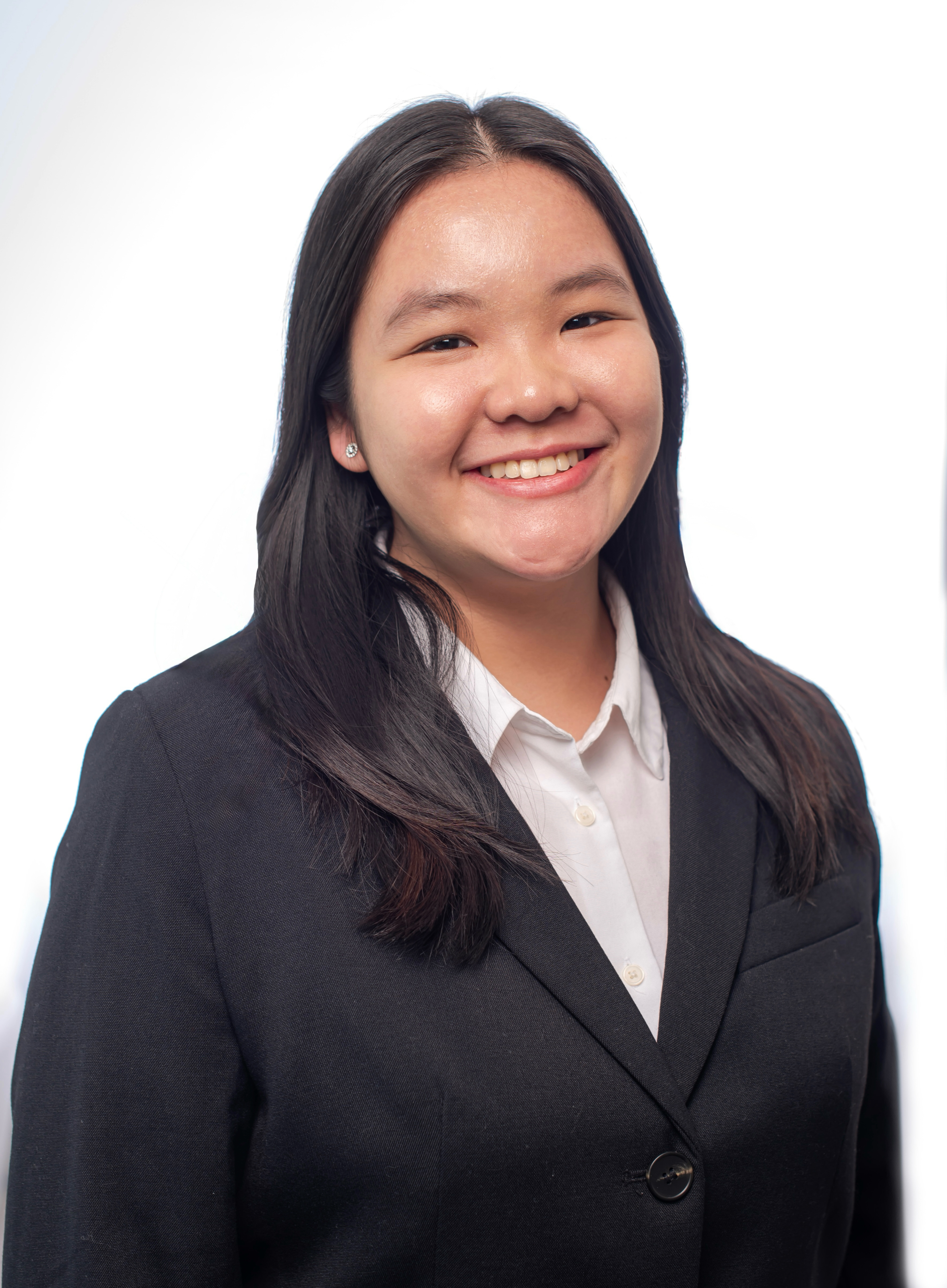 Caitlyn Lim photo - a student with black hair smiling at the camera and wearing a blue blazer
