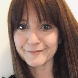 Sara Hattersley, a white woman with brown hair looking at the camera