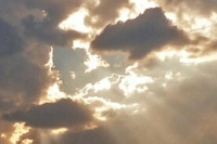 Sunlight shing through gaps in clouds
