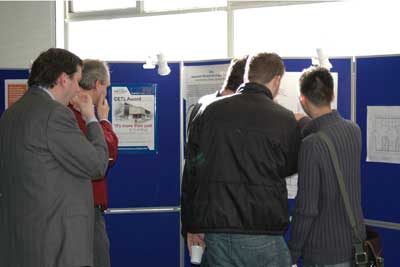 Photo of attendees looking at display stands