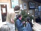 Jon, Daisy and Sarah watch the looping DVD at Heligan that gave a flavour of how the production would have looked at Eden.