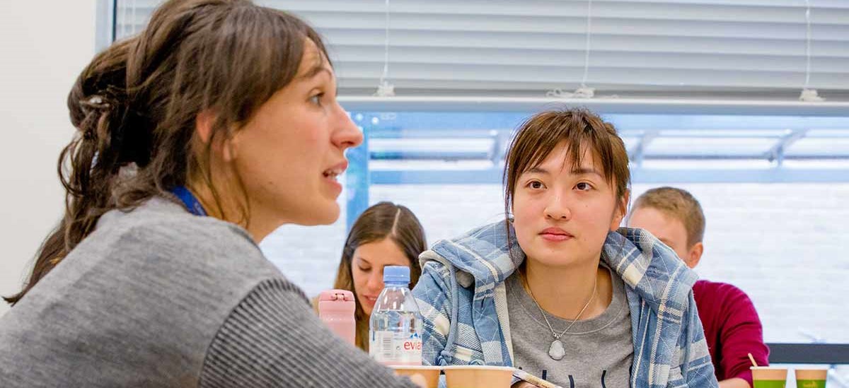 Academic talking to students