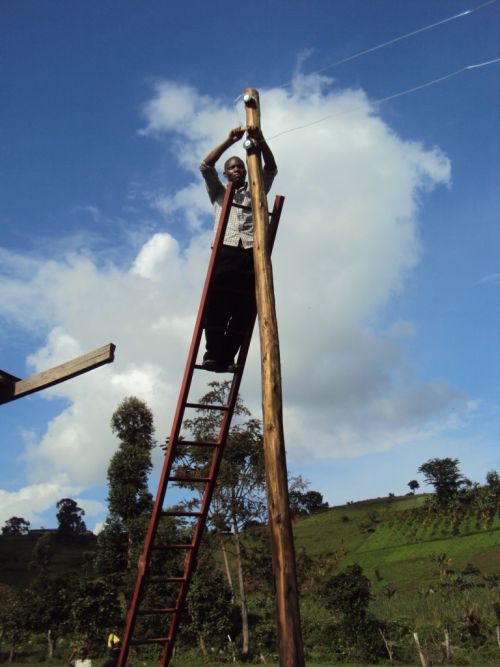 Figure 10: Local maintenance engineer wiring a transmission pole