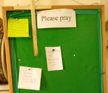 Unofficial multilingual prayer board.