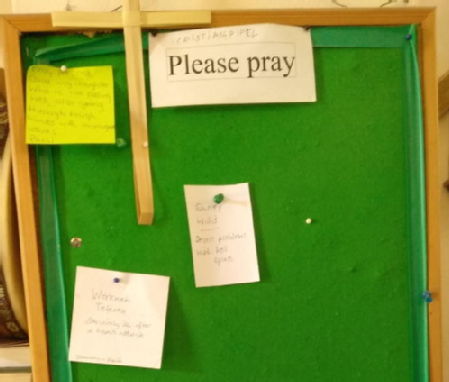 Multilingual unofficial prayer board.