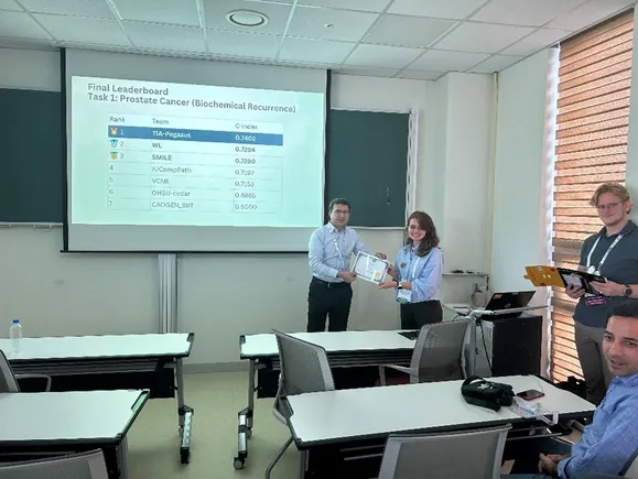 TIA-Pegasus team receiving the CHIMERA Challenge award for Task 1