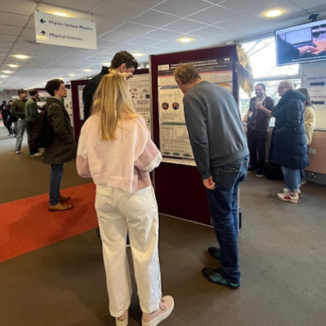 people looking at research posters 