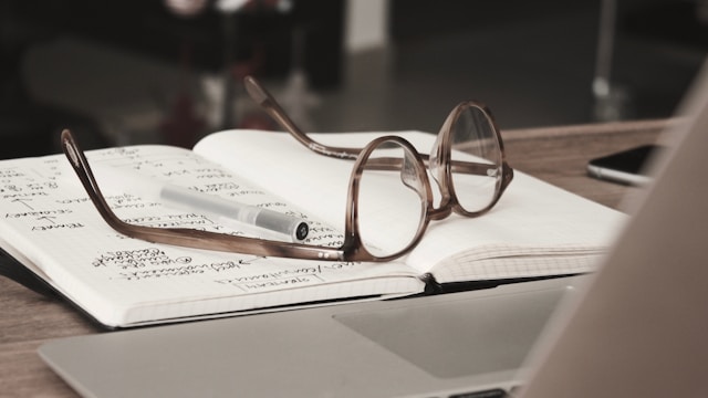 Glasses on an open notebook