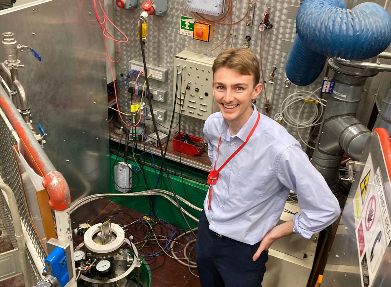 researcher in lab smiling