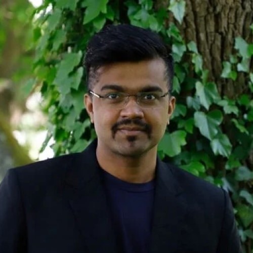 A picture of Somnath Mondal, a man smiling at the camera.