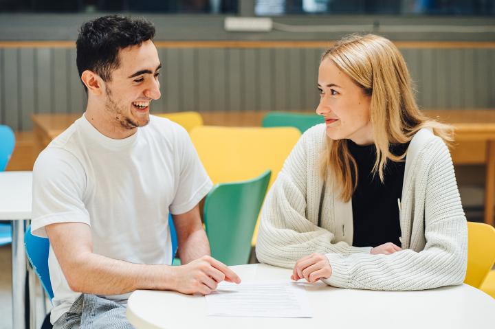 Students sitting together at a table.