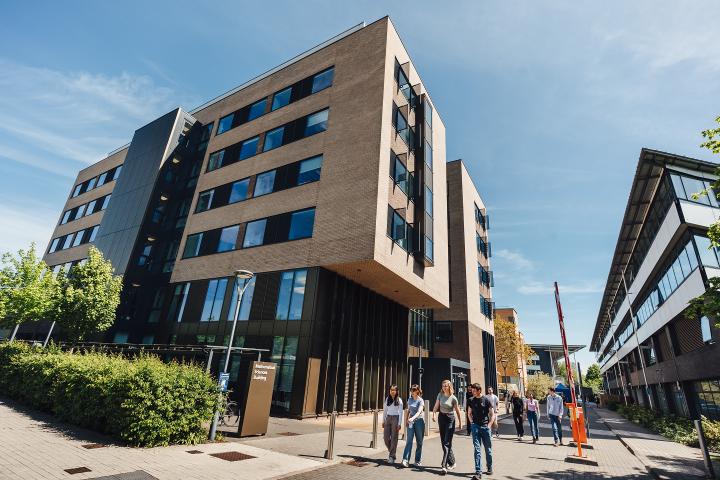 Students walking past the Mathematical Sciences Building.