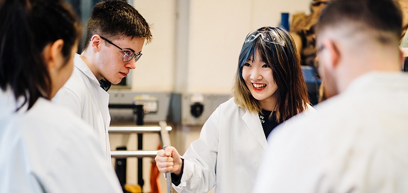 students wearing lab coats