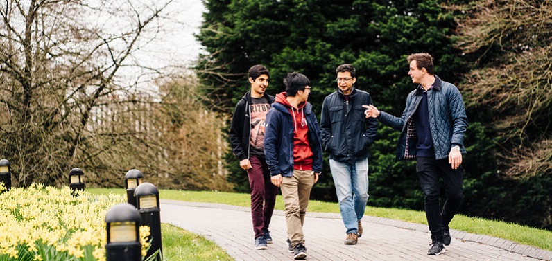 students walking across campus