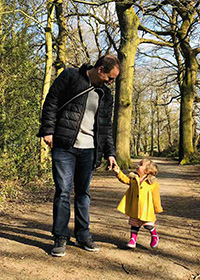 Rob on a walk through the woods with his daughter