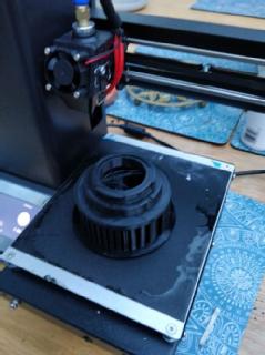 A 3d printer making a camera part