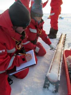 Dr Alison Webb inspects an ice core obtained during the MOSAiC arctic expedition