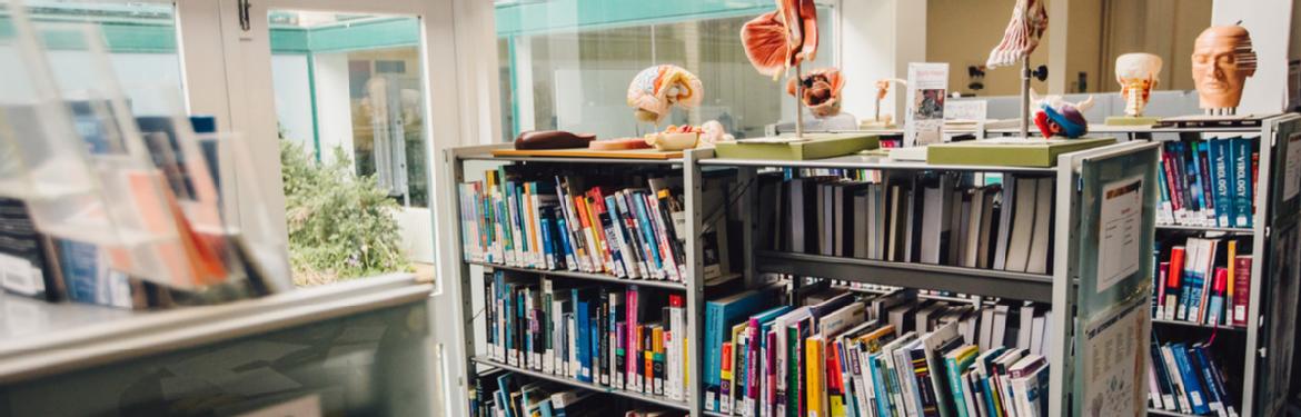 Books on shelves in the BioMed Grid