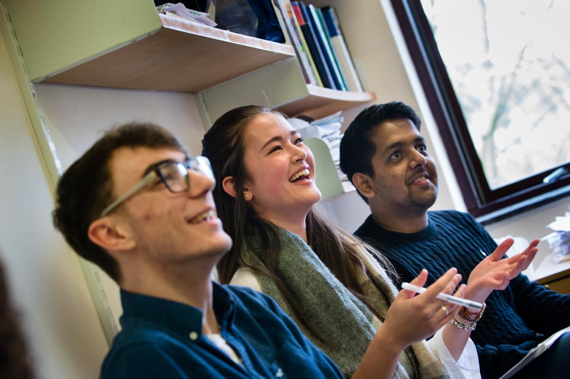 Students smiling in a tutorial