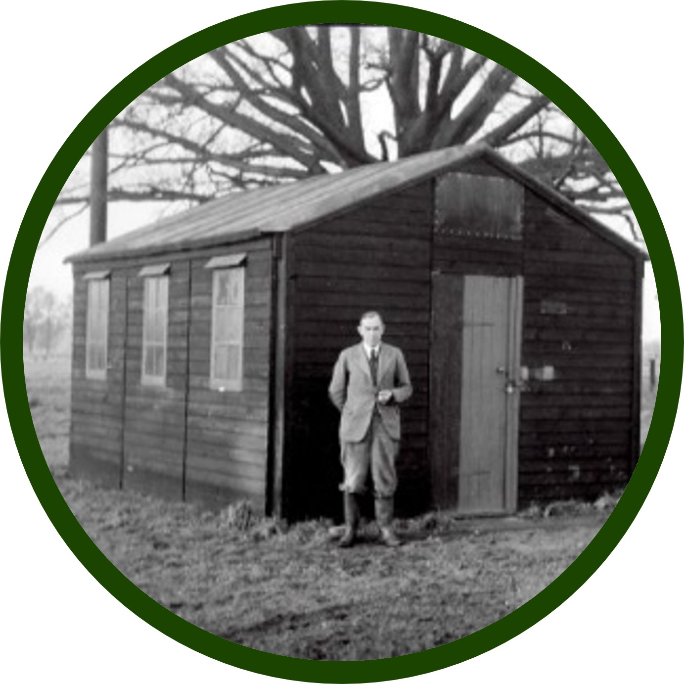 Man stood in front of a shed