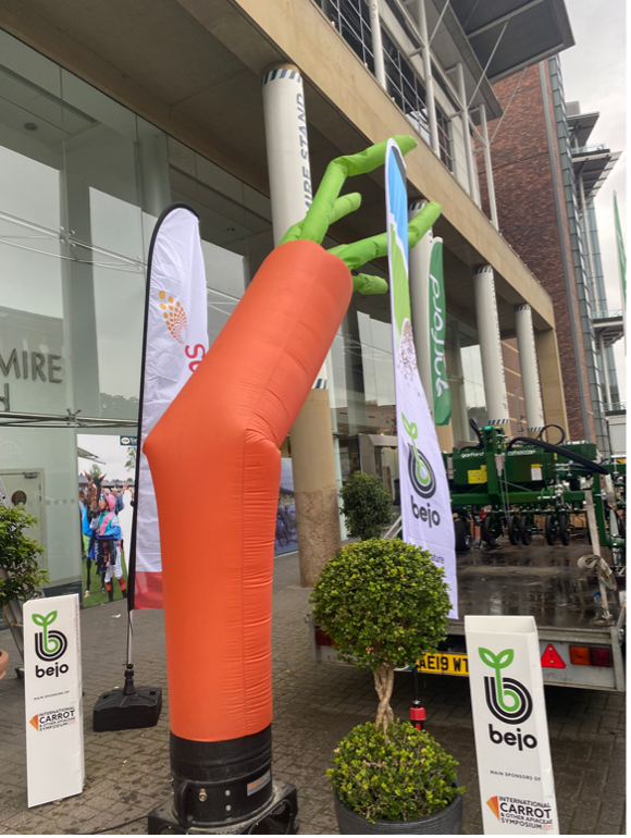 Outside of conference venue with signage and carrot decoration
