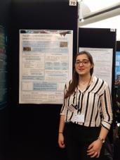 me presenting a poster at the houses of parliament