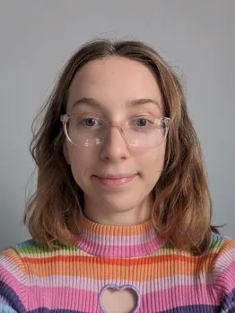 Picture of a woman with short brown hair and glasses