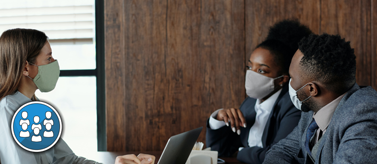 Public Health - meeting between three people in face masks