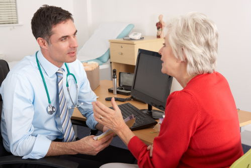 Male GP with woman