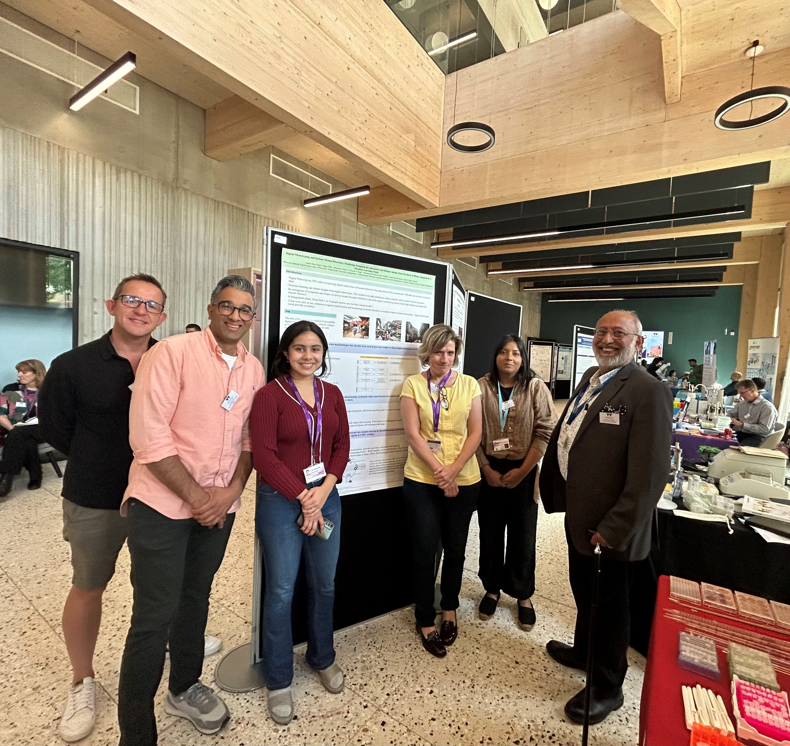 Nadia presents her poster to the wider TRANSFORM team