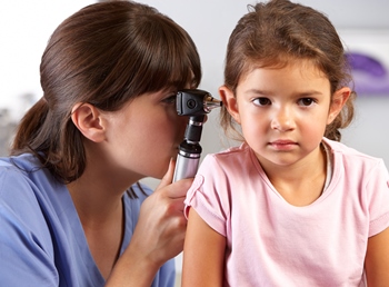 doctor examining child patient