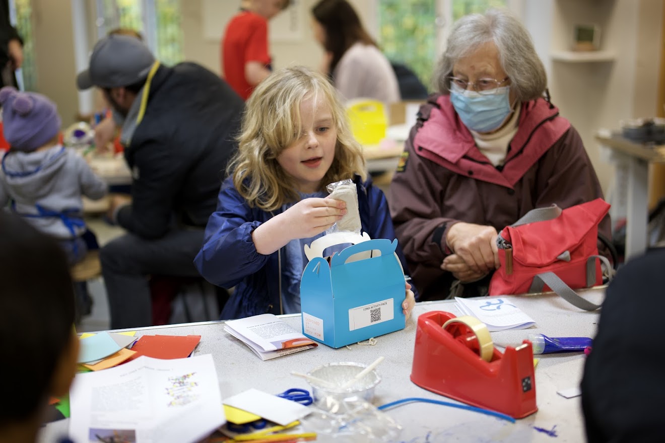 Child participating in craft event