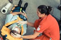 shutterstock-_paramedic_with_patient_on_stretcher.jpg