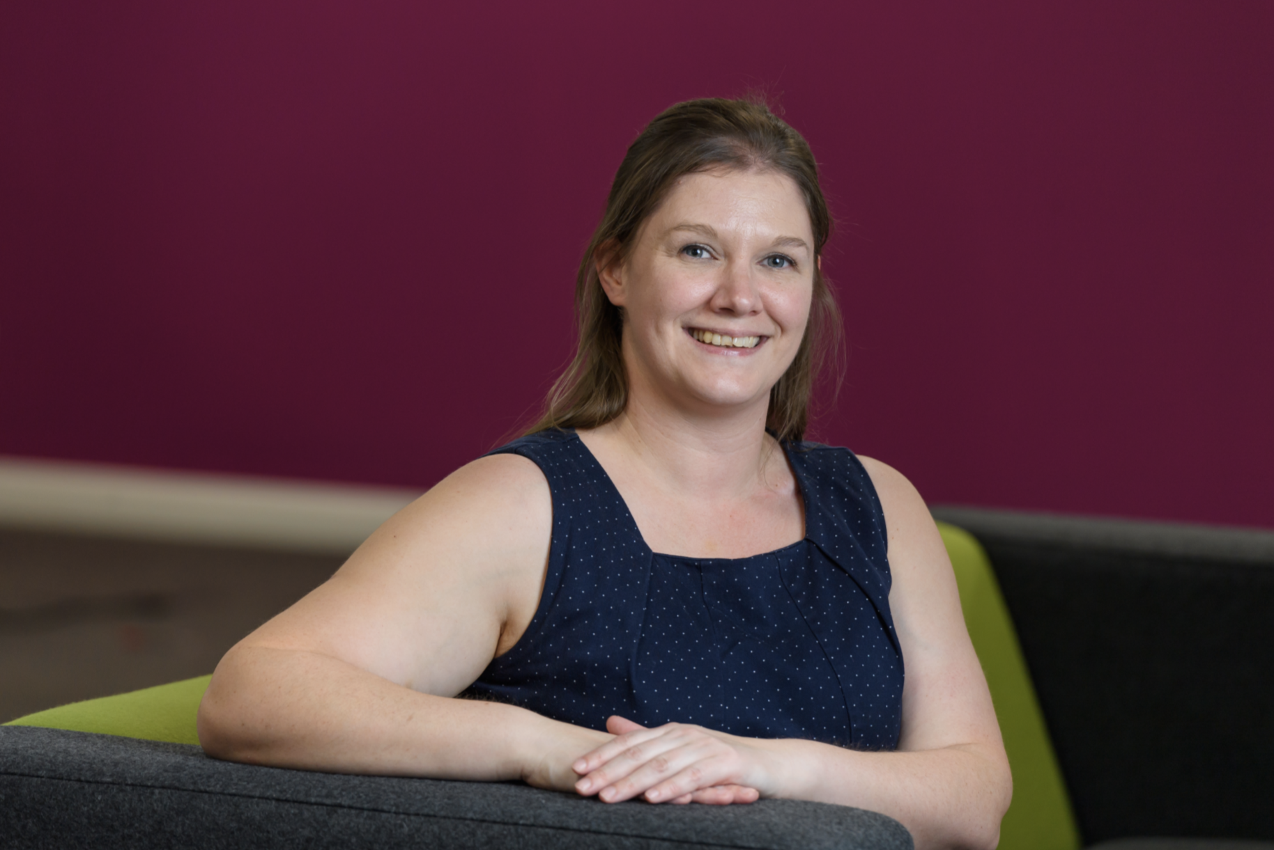 Dr Helen Poulton sitting on a chair